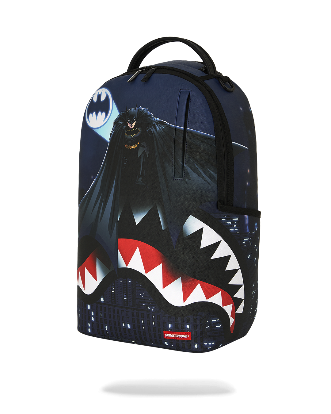 SPRAYGROUNDÂ® BACKPACK USSF x DC BATMAN OVER SHARKMOUTH BACKPACK